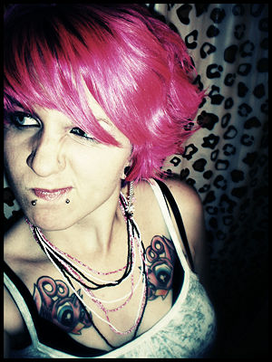 Many punks have unnatural hair colors such as hot pink, blue, and orange.
